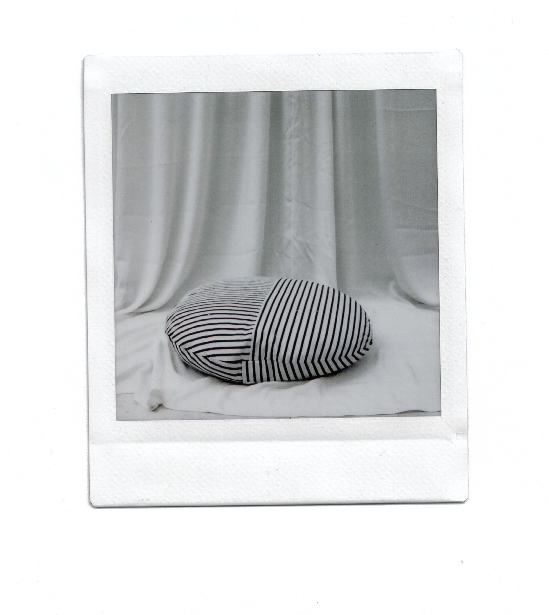 Round striped linen cushion